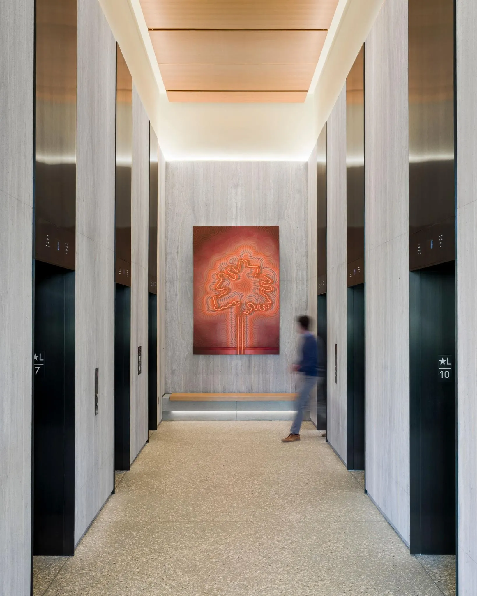 Glowing red and orange painting of a tree at the end of a stone elevator lobby, artwork by Joey Wolf