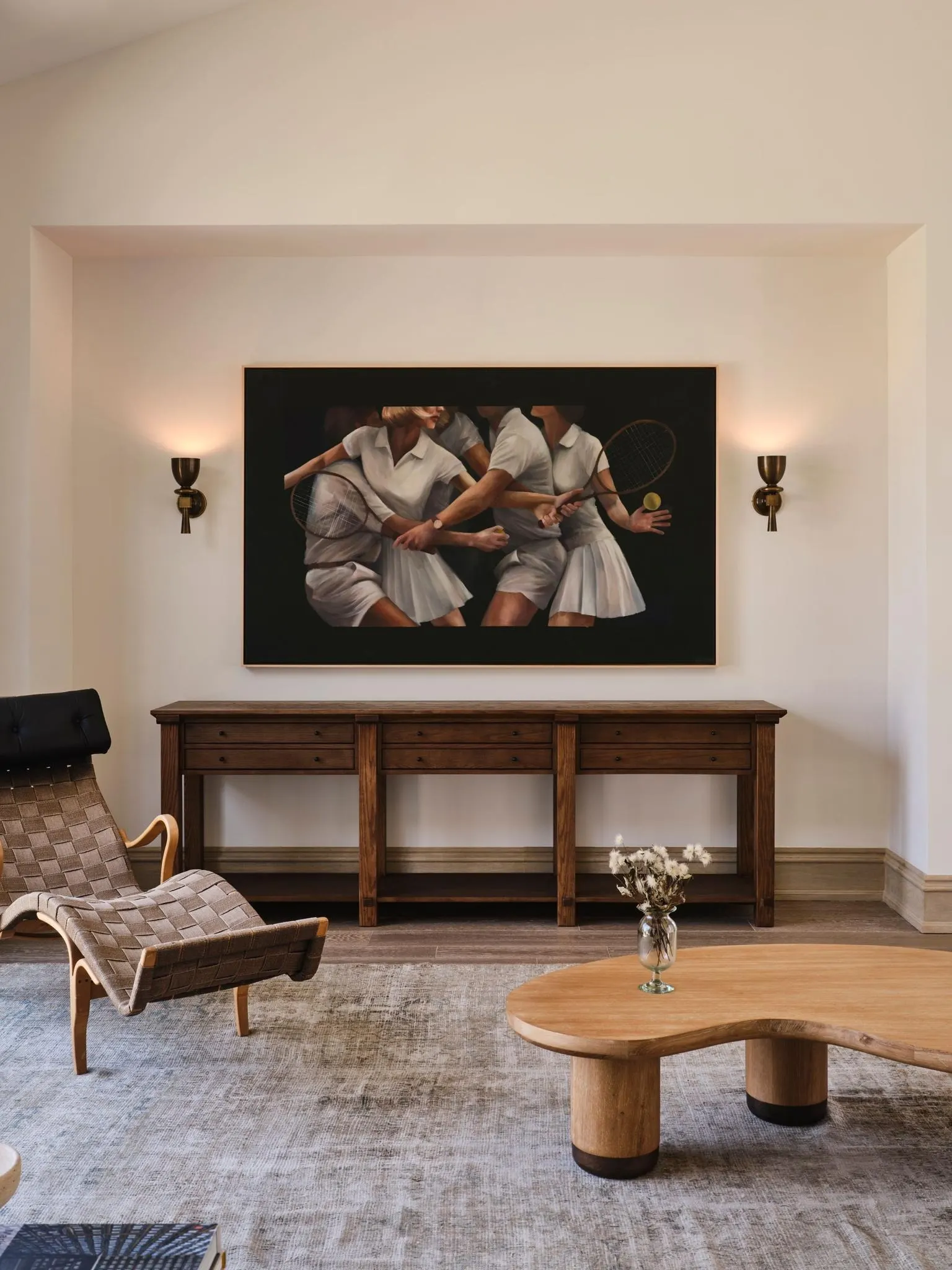 Large painting of women in white tennis dresses above a wood console, artwork by Holly Lowen