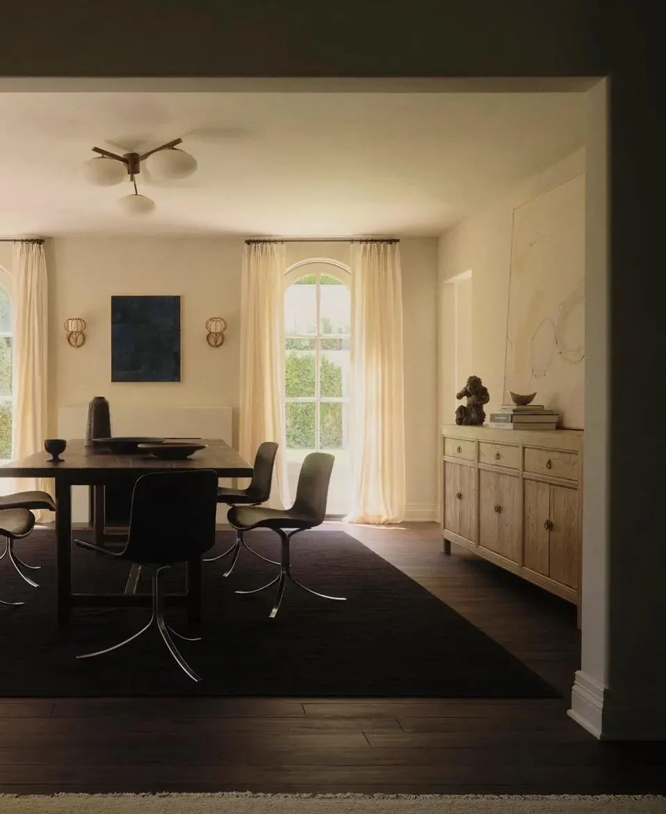 Dining room with a dark blue painting and pale abstract over a sideboard, artwork by Lawrence Calver and Flora Hauser