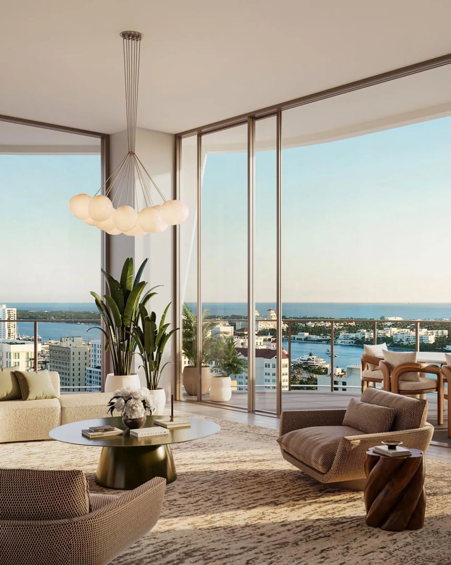 Living room rendering with a globe chandelier, curved glass walls and wide views over the West Palm Beach waterfront