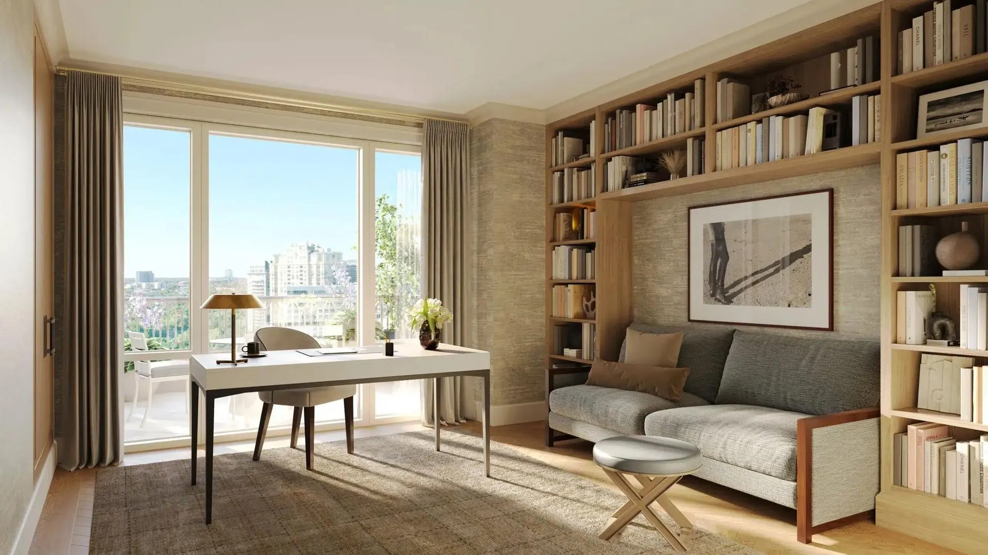 Rendering of a study with built in bookshelves and a framed black and white abstract above a gray sofa