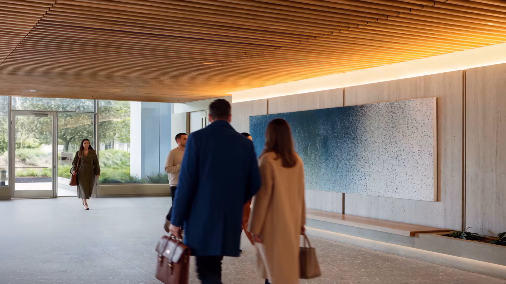Large blue contemporary painting installed in a modern lobby with a wood slat ceiling